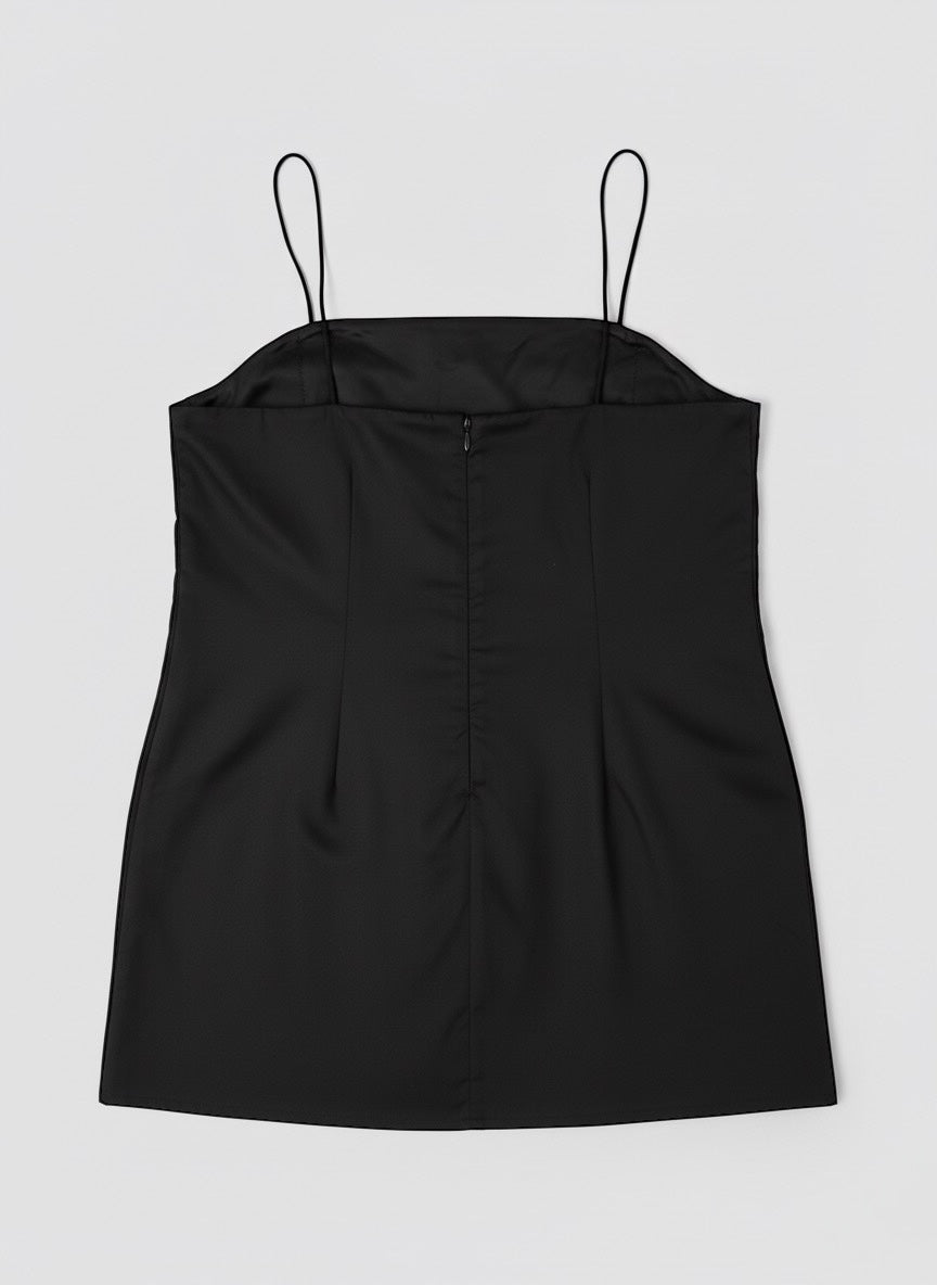 La robe noire à avoir avec ses fines bretelles et poches latérales par LAMANIAK à Paris